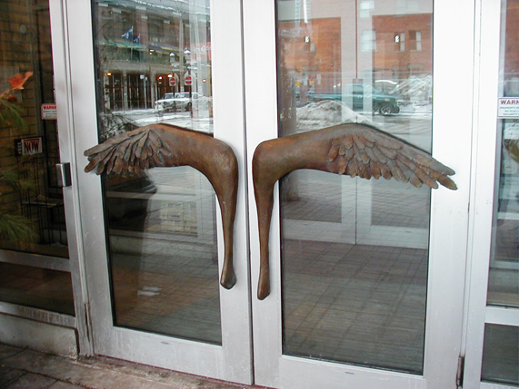 photo of door handles like wings by Ingrid Cryns