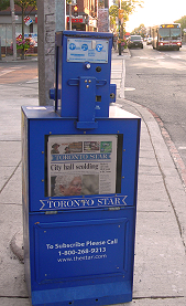 Photo of Toronto Star street sales box with Mary Hynes on front page visible, July 29, 2011